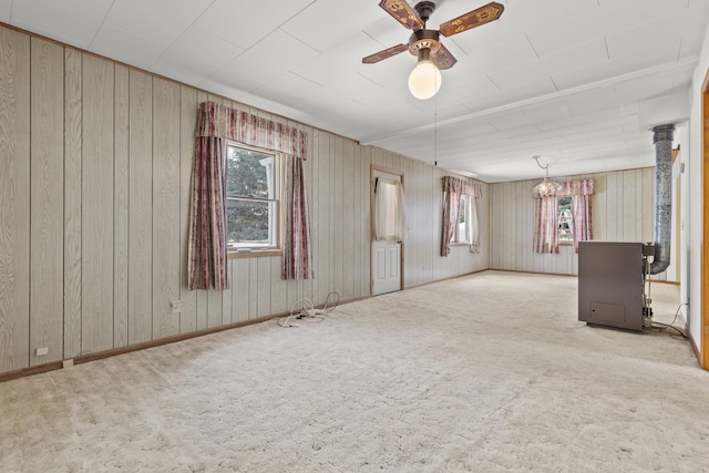 spare room featuring plenty of natural light, light colored carpet, and ceiling fan