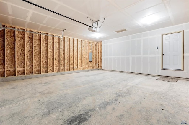 garage featuring a garage door opener and electric panel