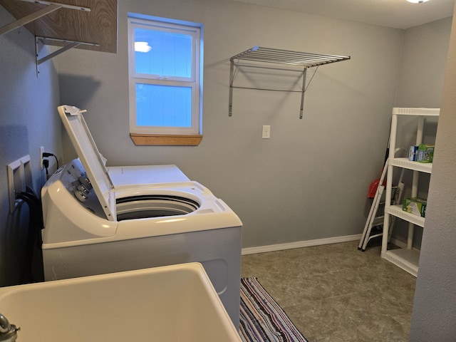 clothes washing area with washer and dryer