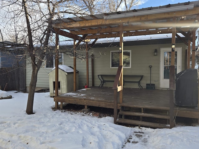 view of snow covered deck