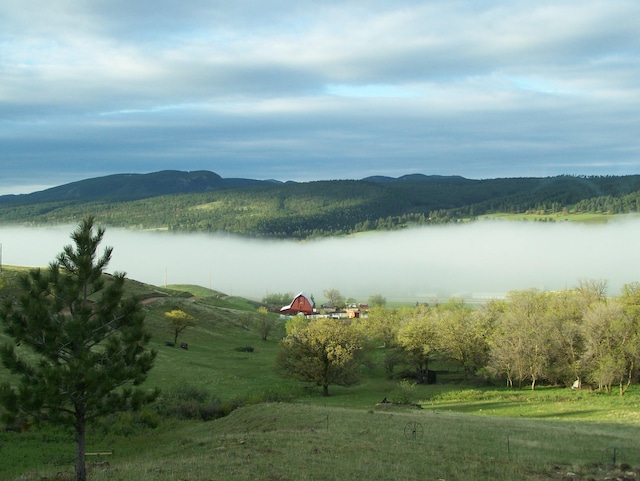 property view of water featuring a rural view and a mountain view