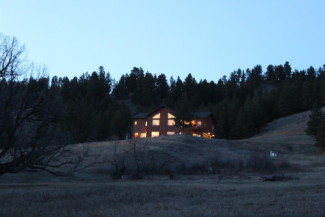 exterior space with a forest view