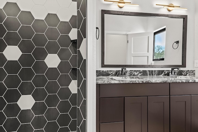 bathroom featuring vanity, tile walls, and walk in shower