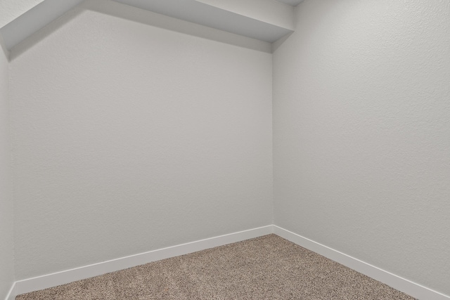 empty room with carpet flooring