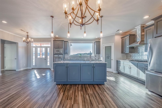 kitchen featuring tasteful backsplash, decorative light fixtures, plenty of natural light, a notable chandelier, and stainless steel appliances