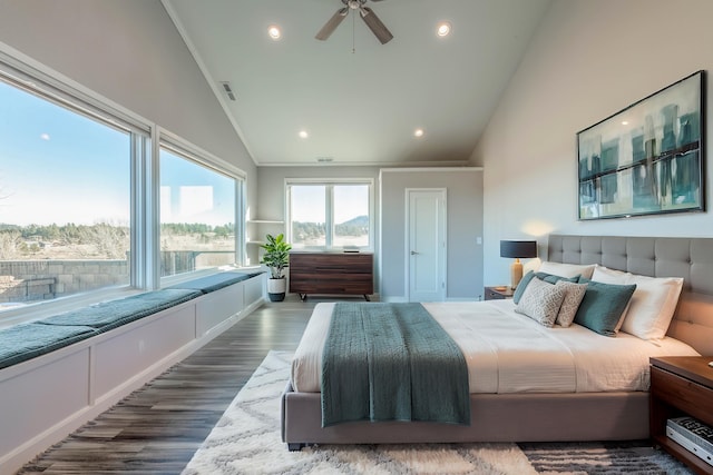 bedroom featuring lofted ceiling, ornamental molding, dark hardwood / wood-style floors, and ceiling fan