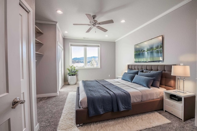 bedroom featuring ceiling fan, ornamental molding, and carpet floors