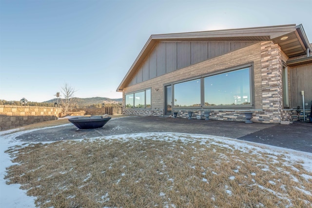 snow covered property with a mountain view