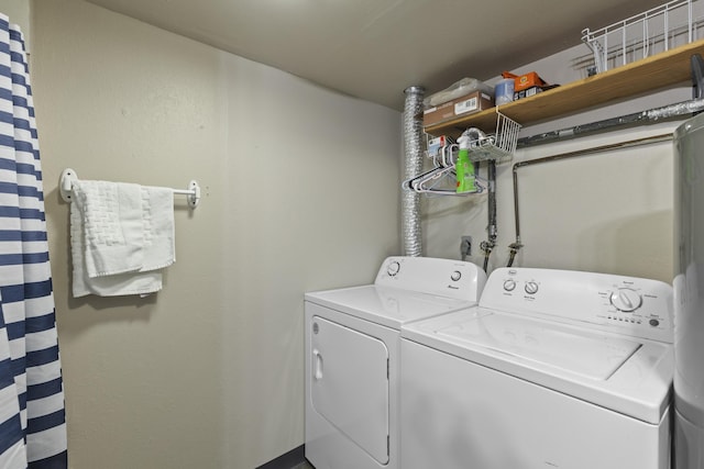 laundry room with independent washer and dryer