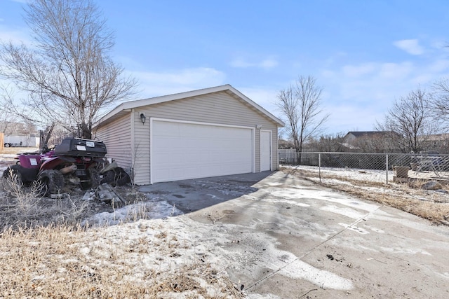 view of side of property featuring a garage and an outdoor structure