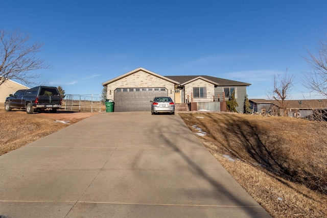 ranch-style house featuring a garage