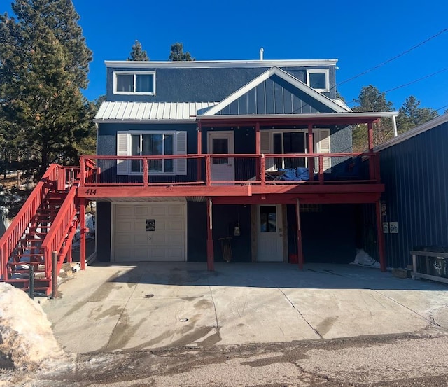 view of front of house with a garage and a deck