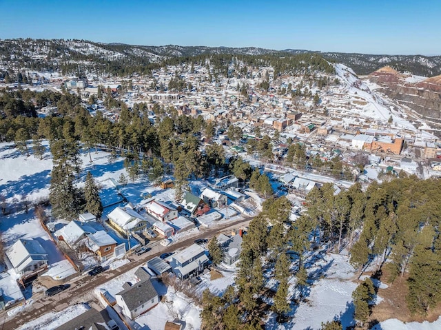 snowy aerial view featuring a mountain view