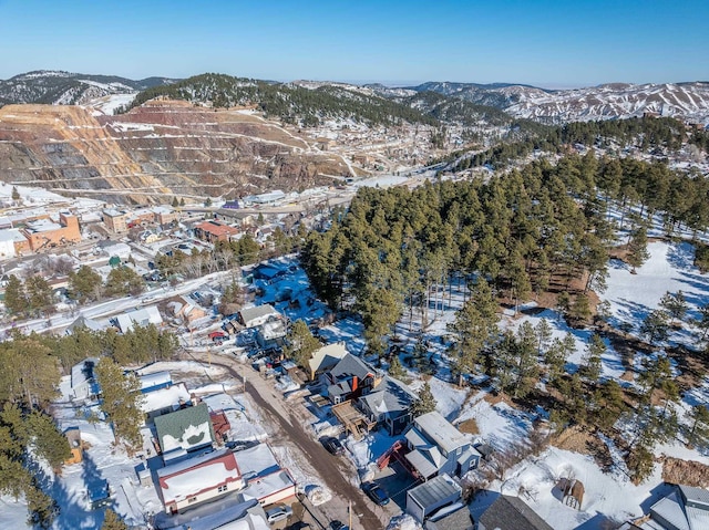 snowy aerial view with a mountain view