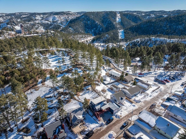 snowy aerial view with a mountain view