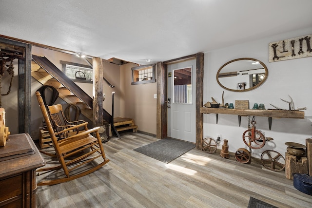 foyer entrance with light hardwood / wood-style floors