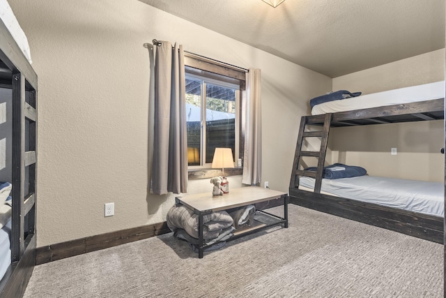 bedroom featuring dark wood-type flooring and a textured ceiling