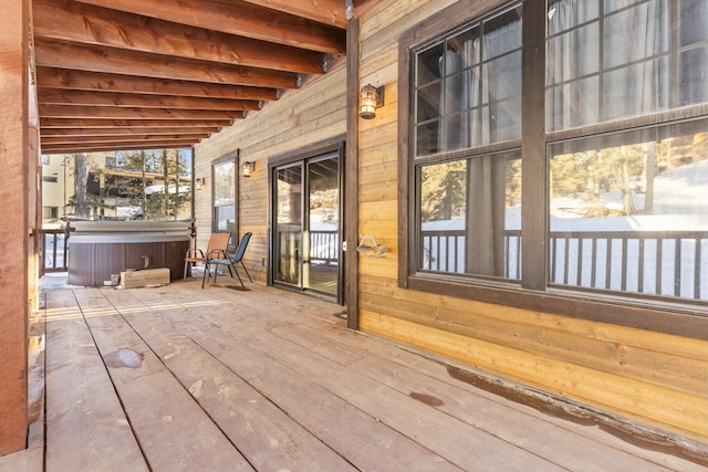 deck with a hot tub