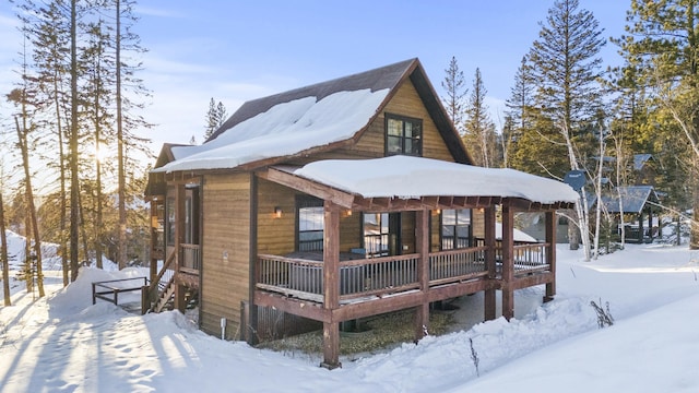 view of snow covered house