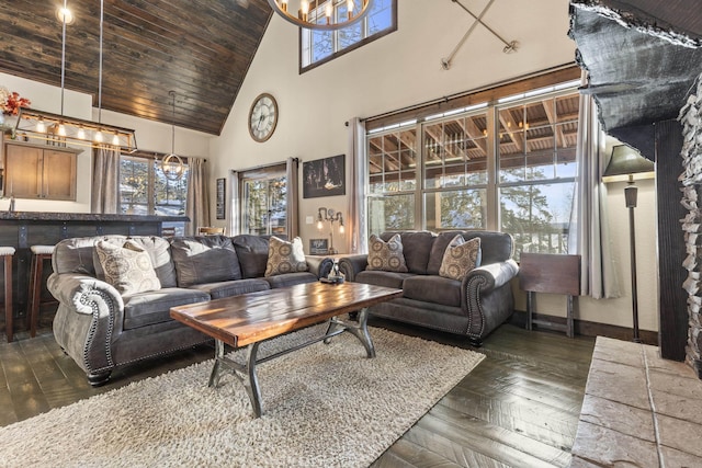 living room featuring wood ceiling, high vaulted ceiling, dark parquet floors, and a notable chandelier