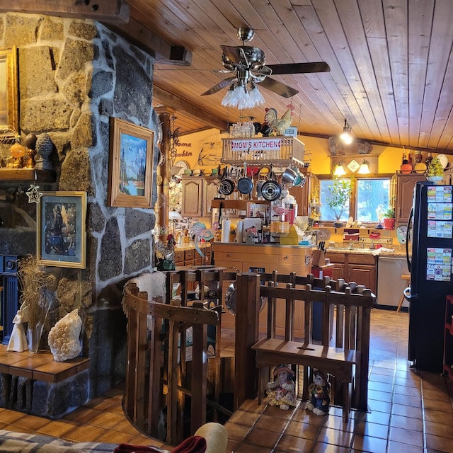 dining area featuring lofted ceiling, tile patterned flooring, wooden ceiling, and ceiling fan