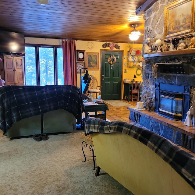 living room with a fireplace, wooden ceiling, and carpet flooring