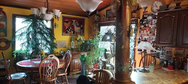 dining space featuring a notable chandelier