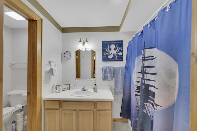 bathroom featuring vanity and toilet