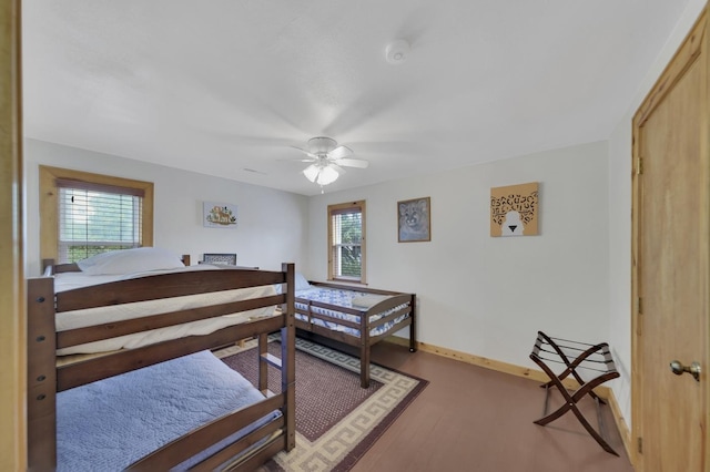 bedroom with hardwood / wood-style floors and ceiling fan