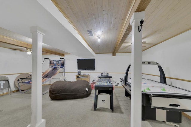 playroom with decorative columns, light carpet, wood ceiling, and beam ceiling