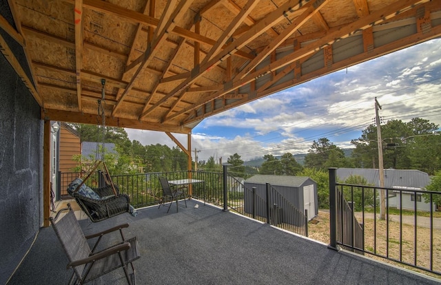 view of patio / terrace with a storage shed