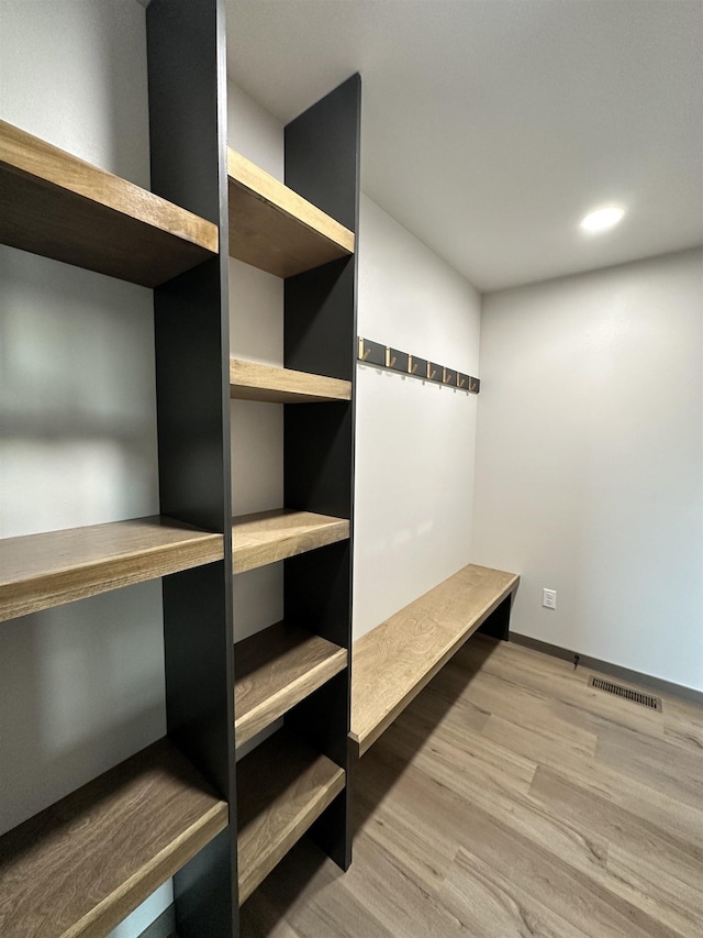 mudroom featuring wood-type flooring