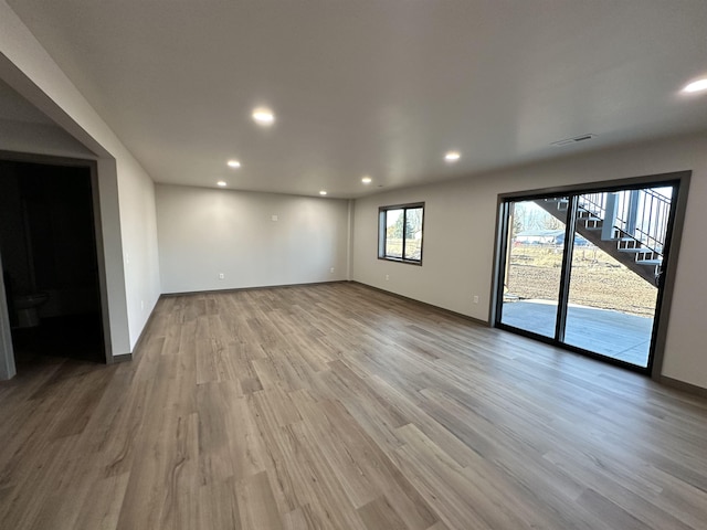 unfurnished room featuring hardwood / wood-style floors