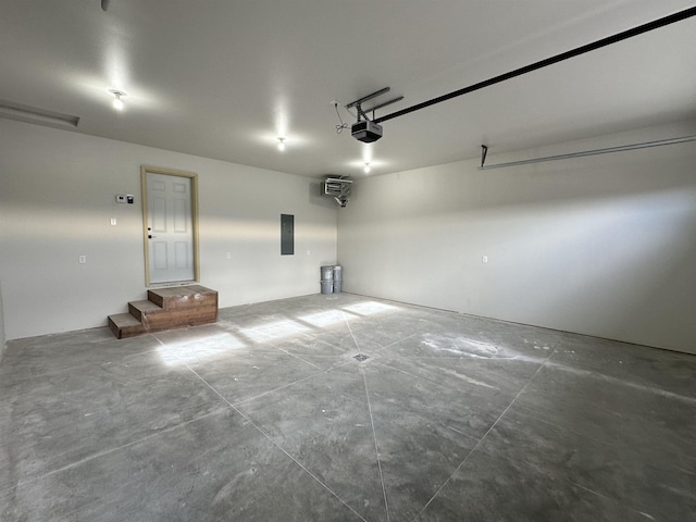 garage featuring a garage door opener and electric panel