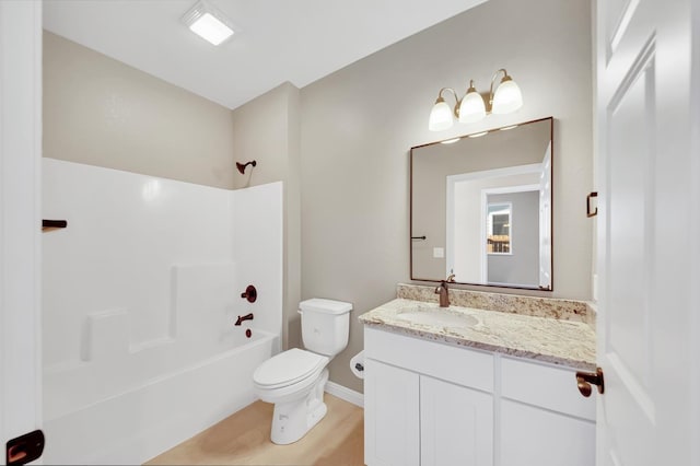 bathroom with shower / bath combination, vanity, and toilet