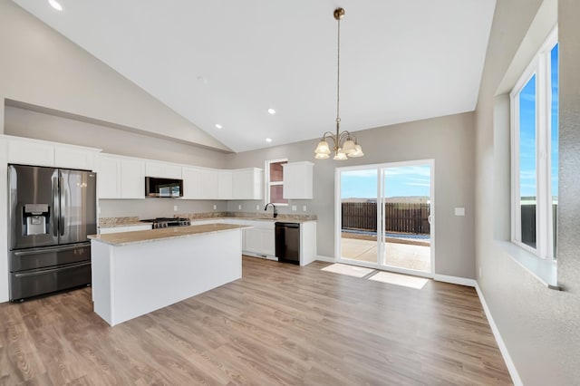 kitchen featuring black dishwasher, white cabinetry, decorative light fixtures, and stainless steel fridge with ice dispenser