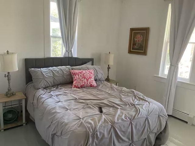 bedroom featuring a baseboard heating unit