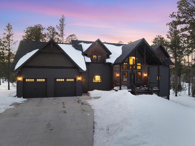 modern inspired farmhouse featuring a garage and covered porch