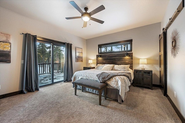 carpeted bedroom with access to exterior, a barn door, and ceiling fan