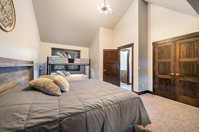 bedroom with high vaulted ceiling, carpet floors, and an inviting chandelier