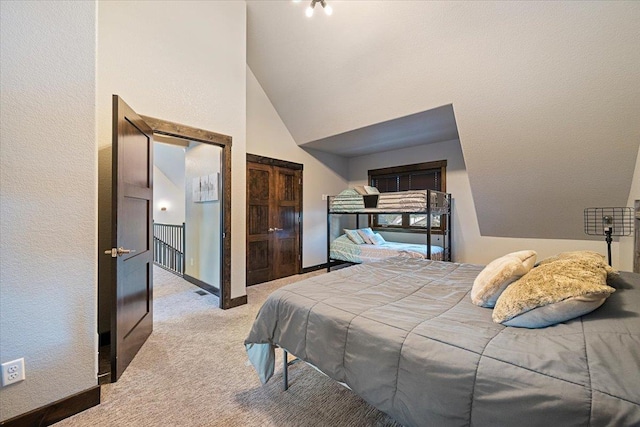 carpeted bedroom with a high ceiling