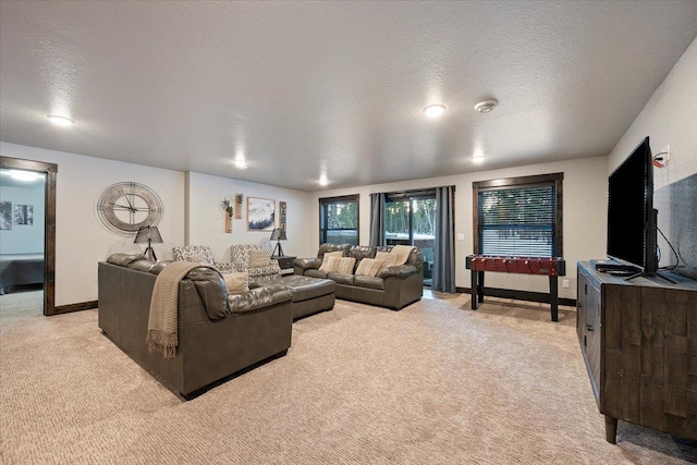 carpeted living room with a textured ceiling