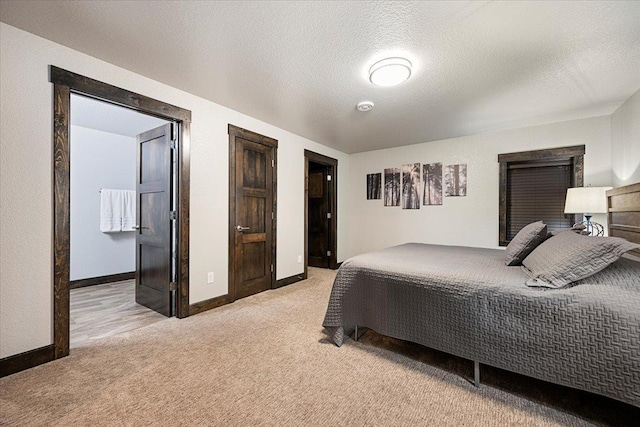 carpeted bedroom with a textured ceiling