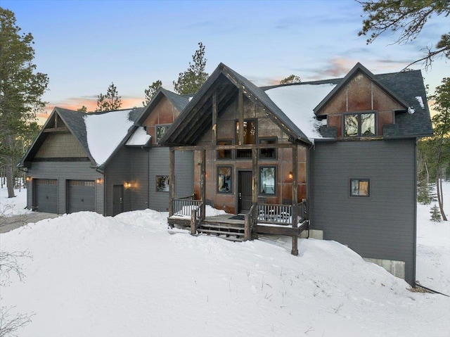 view of front of property featuring a garage and covered porch