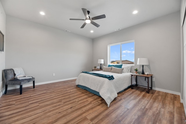 bedroom with hardwood / wood-style flooring and ceiling fan