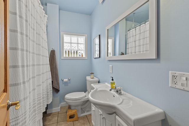 bathroom with tile patterned flooring, vanity, a shower with shower curtain, and toilet