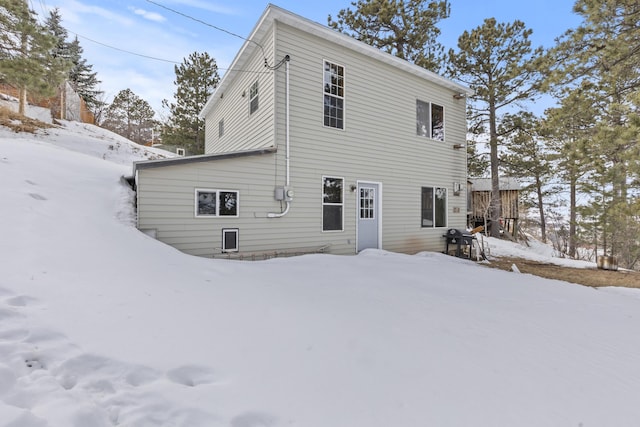 view of snow covered house