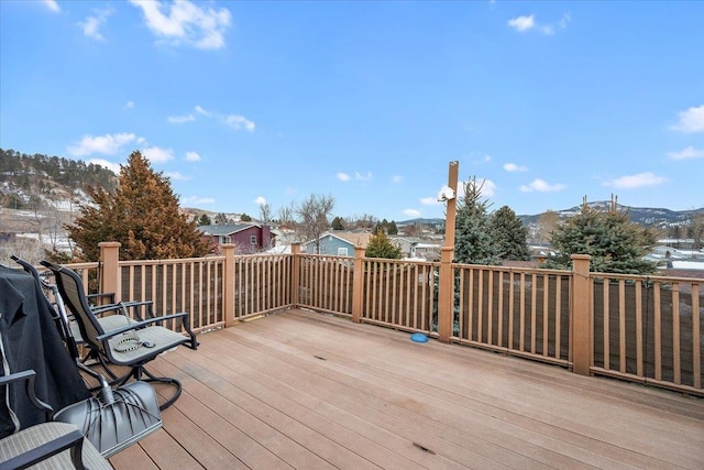 wooden deck with a mountain view