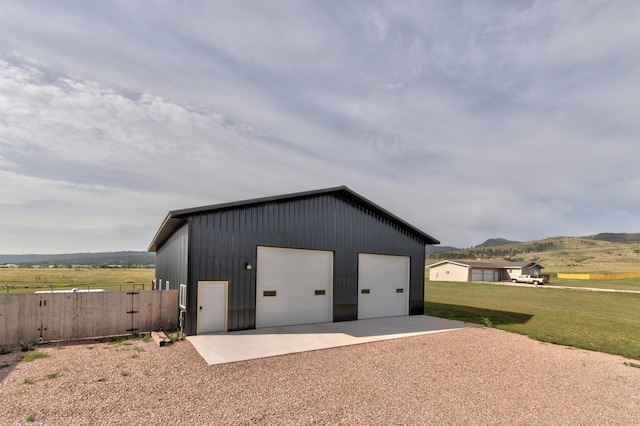 garage featuring a lawn