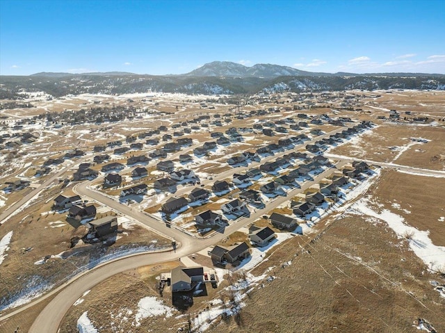 snowy aerial view with a mountain view